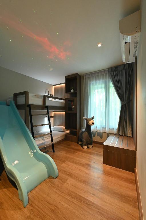 Postel nebo postele na pokoji v ubytování Moose Hotel Nimman