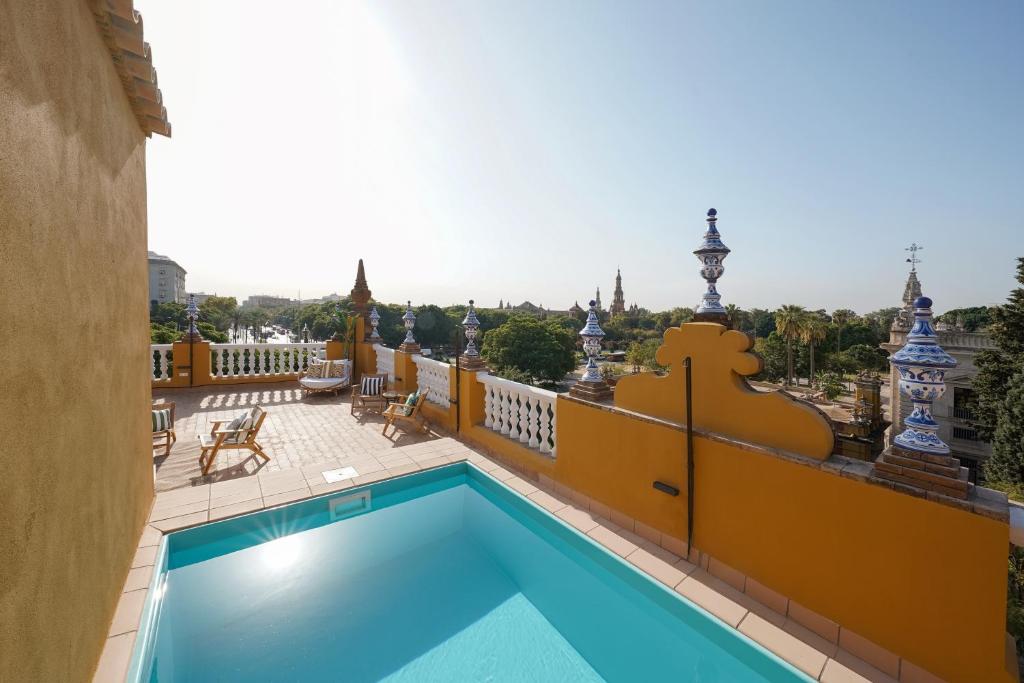 a swimming pool on the balcony of a building at numa I Prestigio Apartments in Seville
