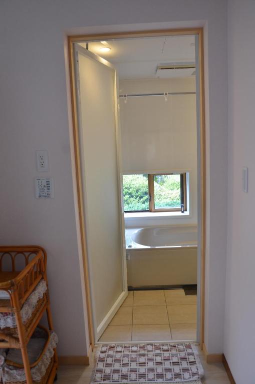 Postel nebo postele na pokoji v ubytování Auberge Fujii Fermier
