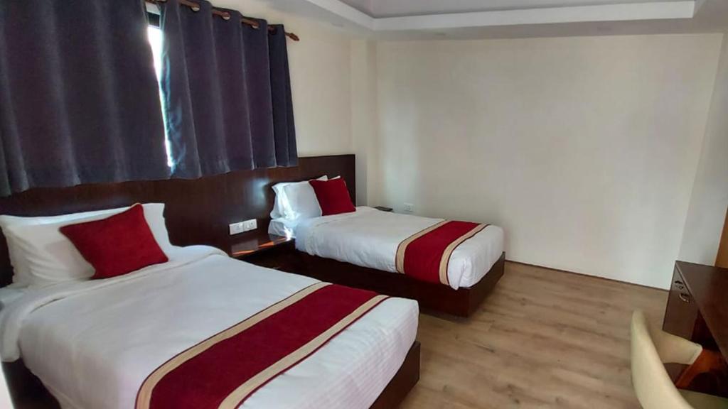 Postel nebo postele na pokoji v ubytování Hotel Grand View