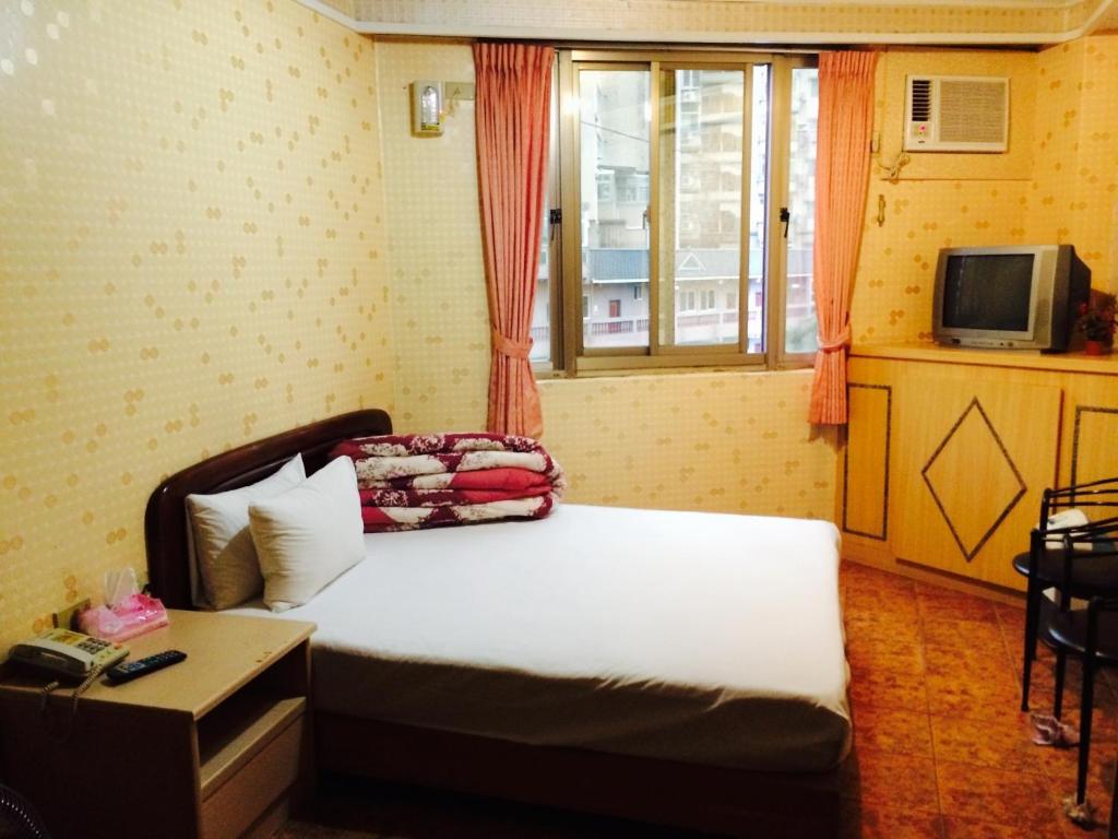 Postel nebo postele na pokoji v ubytování Kai Cheng Inn 旅館134