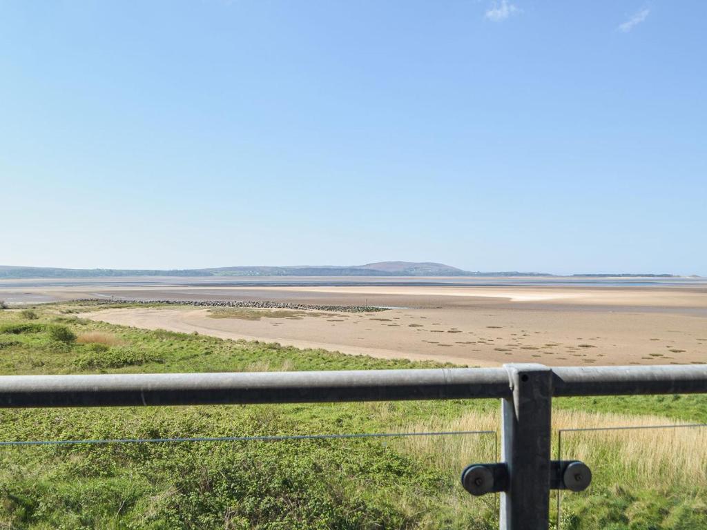 a view of the beach from a fence at Bayview in Llanelli