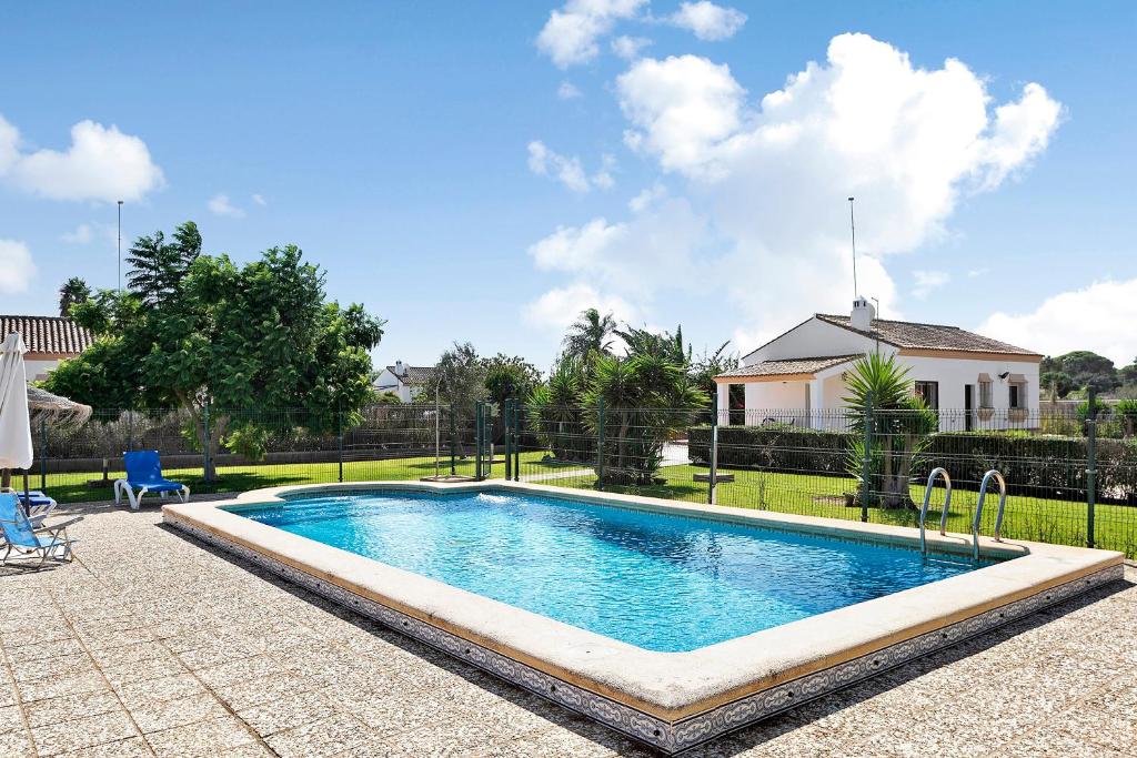 a swimming pool in front of a house at Villa Perez Zara Paco in Campano