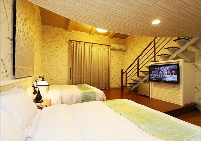 Postel nebo postele na pokoji v ubytování Zhuyuan Ju B&B
