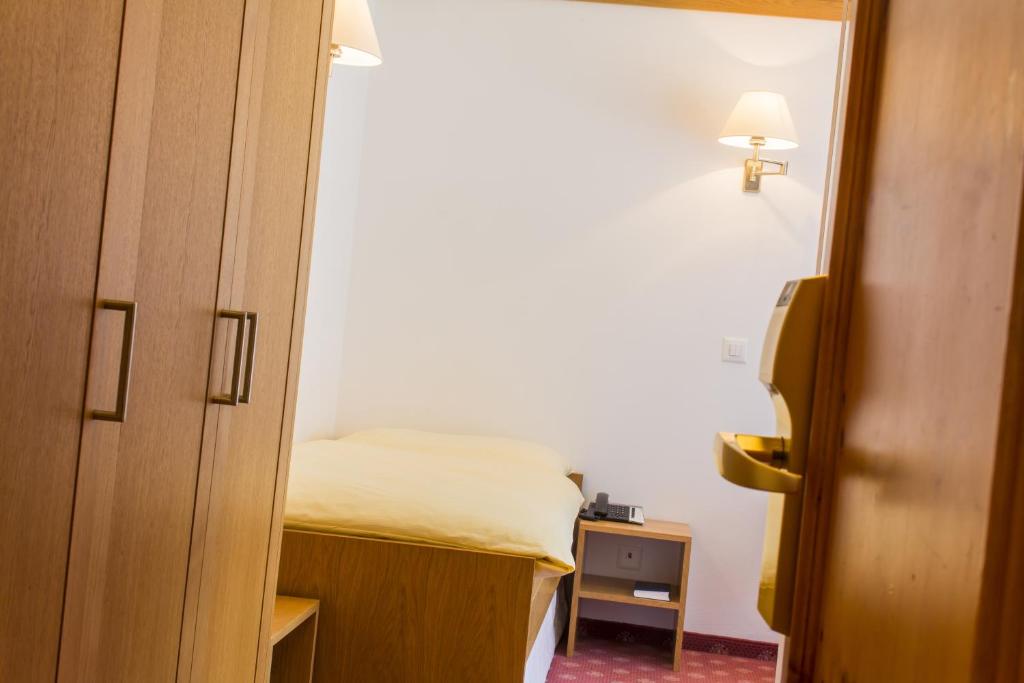 Postel nebo postele na pokoji v ubytování Hotel Excelsior
