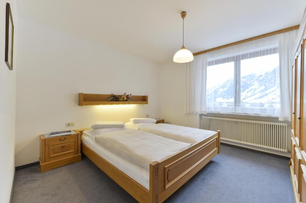 Postel nebo postele na pokoji v ubytování Hotel Bergheim