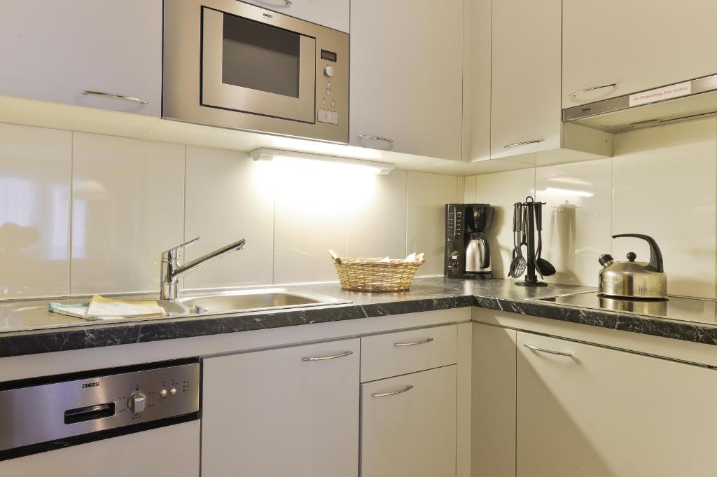 Kuchyň nebo kuchyňský kout v ubytování Hotel Bergheim