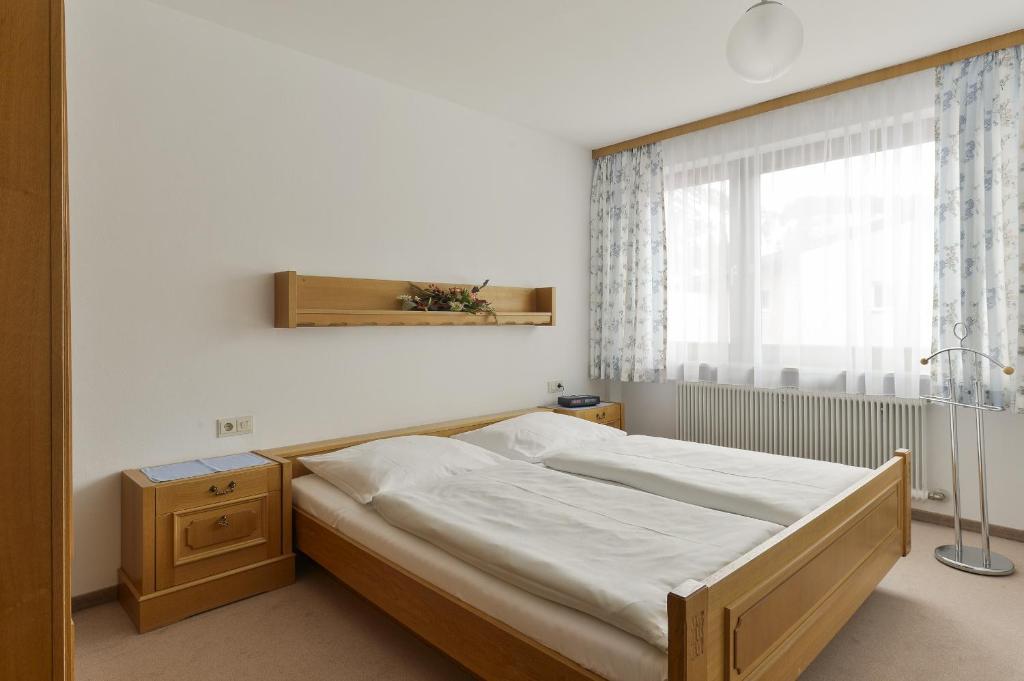 Postel nebo postele na pokoji v ubytování Hotel Bergheim