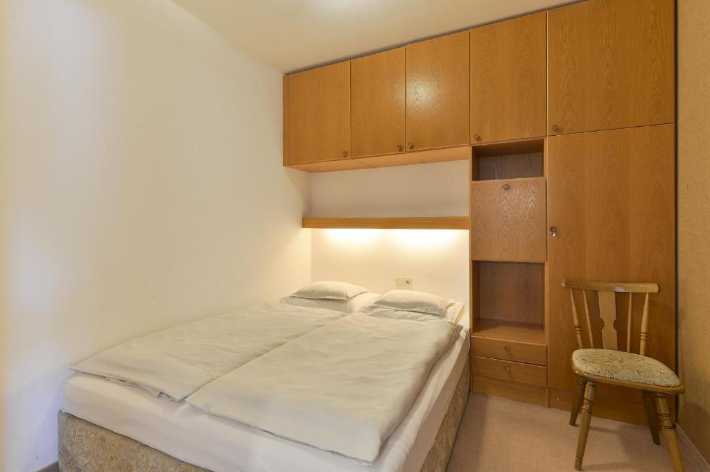 Postel nebo postele na pokoji v ubytování Hotel Bergheim