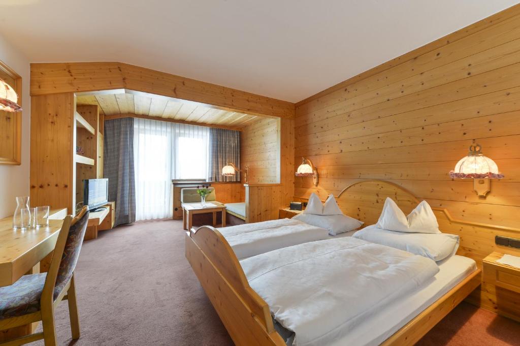 Postel nebo postele na pokoji v ubytování Hotel Bergheim