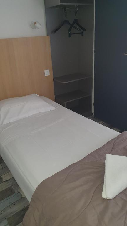 Postel nebo postele na pokoji v ubytování Welcomotel Limoges