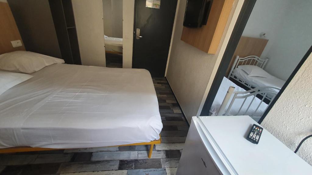 Postel nebo postele na pokoji v ubytování Welcomotel Limoges