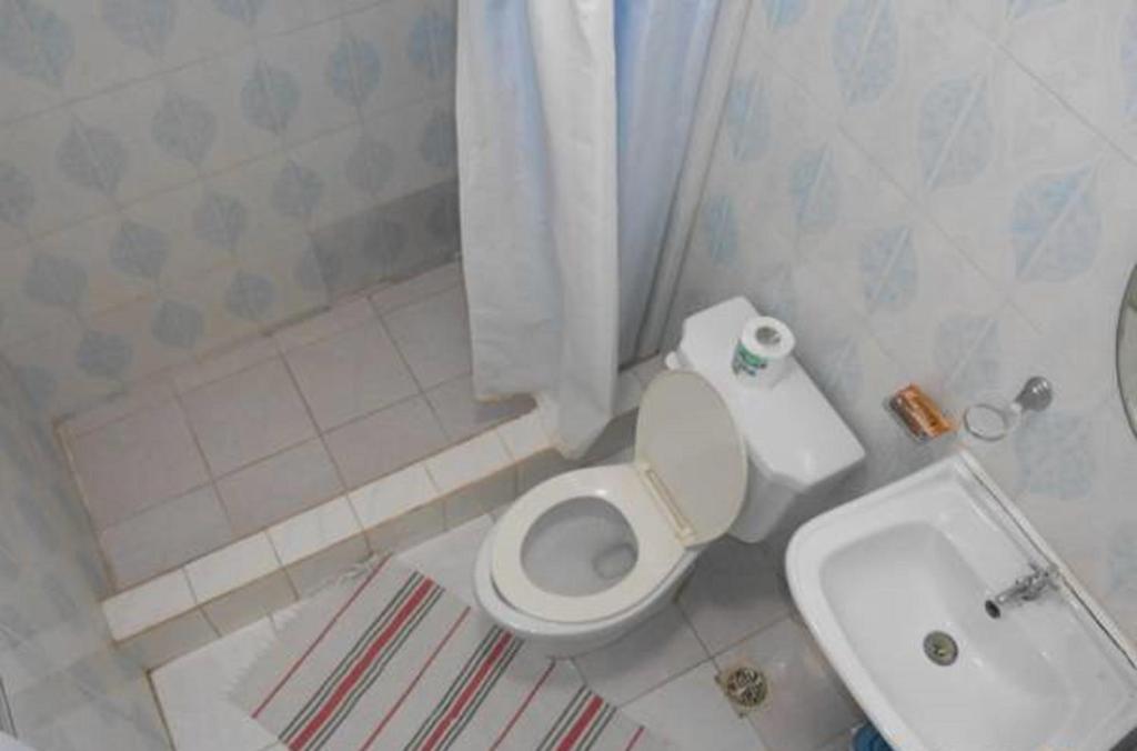 Koupelna v ubytování Lucy Rooms
