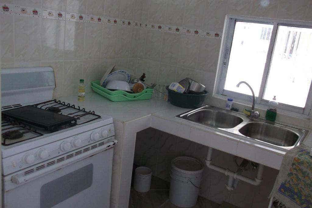 Kuchyň nebo kuchyňský kout v ubytování Lucy Rooms