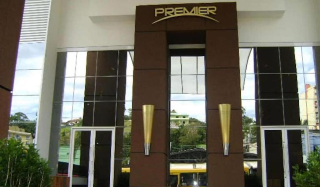 a front view of a building with a fire department sign at Loft no coração da cidade de Blumenau in Blumenau