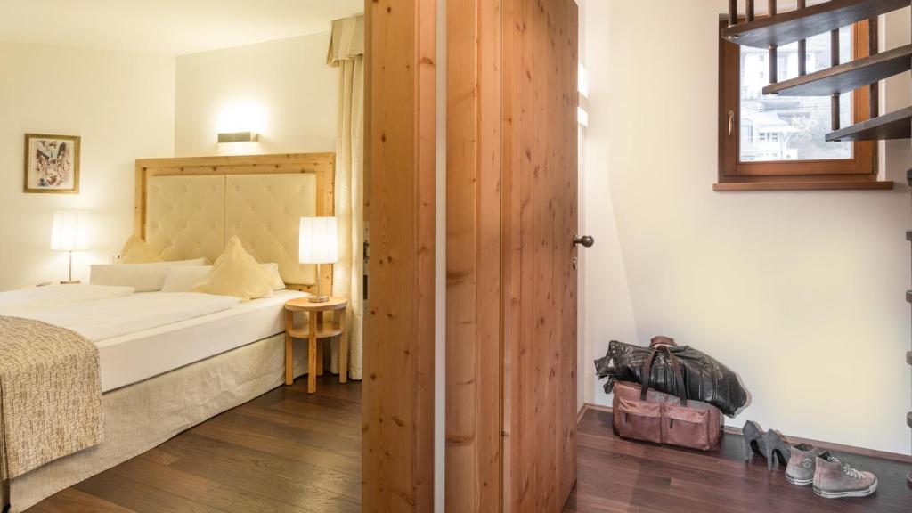 Postel nebo postele na pokoji v ubytování Hotel Leitner