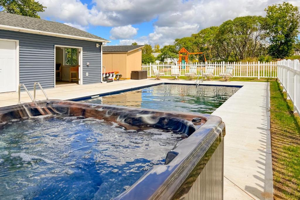 a swimming pool in the backyard of a house at Bridgeview Retreat in North Hero