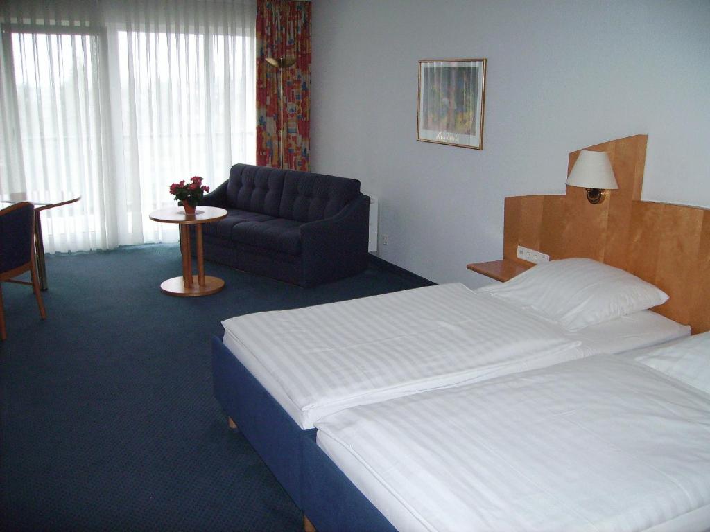 Postel nebo postele na pokoji v ubytování Hotel Görres