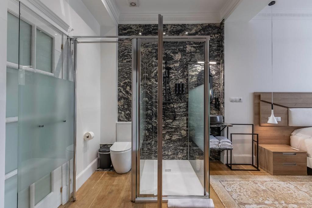 Кровать или кровати в номере Habitaciones Apartamento B&B Plaza Nueva 8