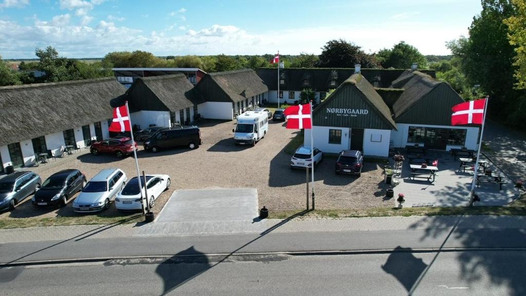 an aerial view of a parking lot with cars at Nørbygaard Fanø in Fanø