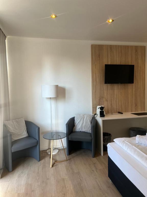 Postel nebo postele na pokoji v ubytování Hotel Mozart