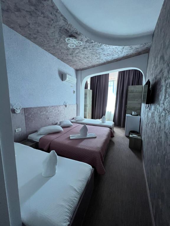 Postel nebo postele na pokoji v ubytování Hotel Minion
