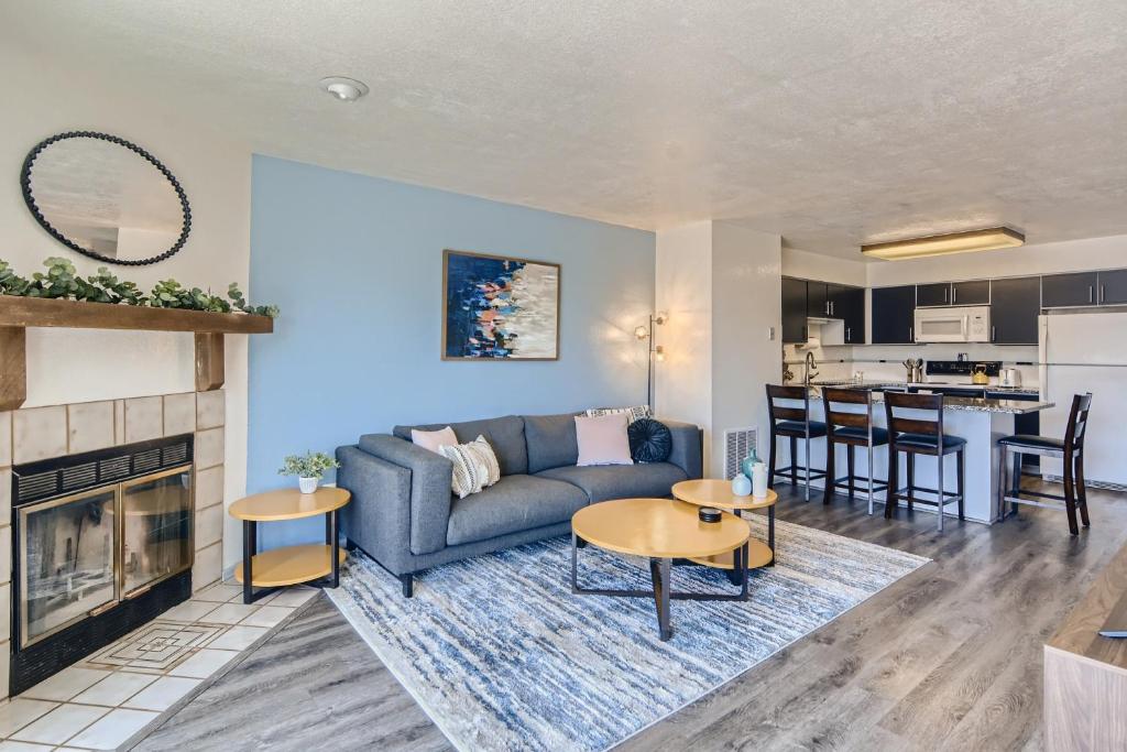 a living room with a couch and a fireplace at RARE FIND Modern Townhome in the Heart of Old Colorado City in Colorado Springs