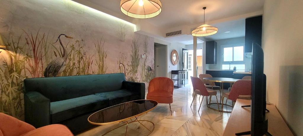 a living room with a couch and a table at San Clemente House in Seville