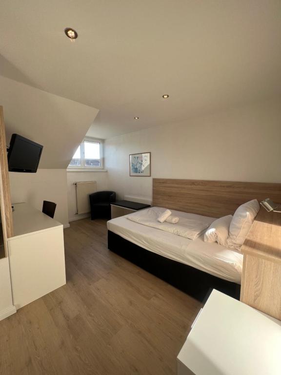 Postel nebo postele na pokoji v ubytování Hotel Mozart
