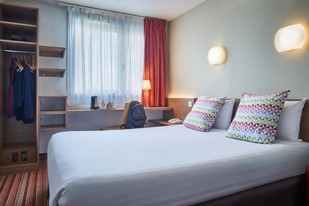 Un ou plusieurs lits dans un h&eacute;bergement de l&#39;&eacute;tablissement Hotel Campanile Paris-Bercy Village