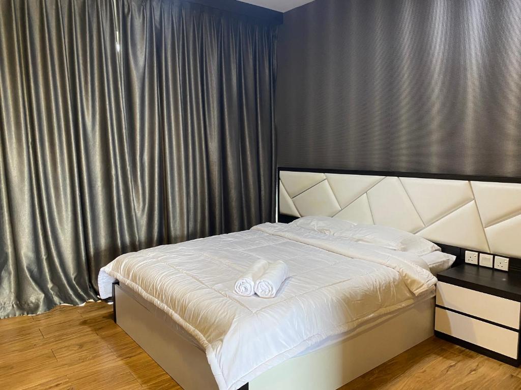 Ένα ή περισσότερα κρεβάτια σε δωμάτιο στο Skyline 1005 floor Nagoya Central City Pelita Batam Apartment