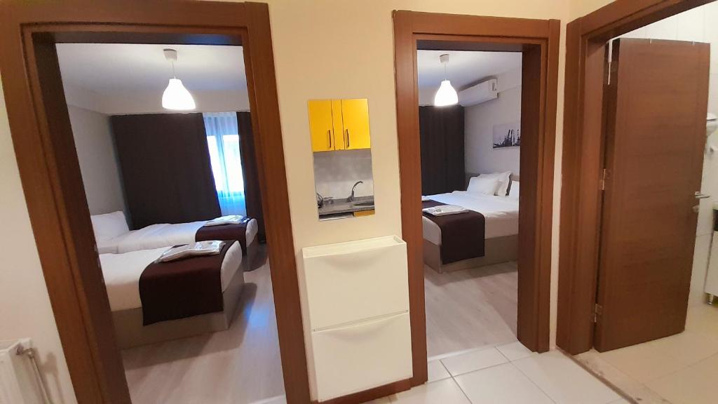 Postel nebo postele na pokoji v ubytování Moda Hotel