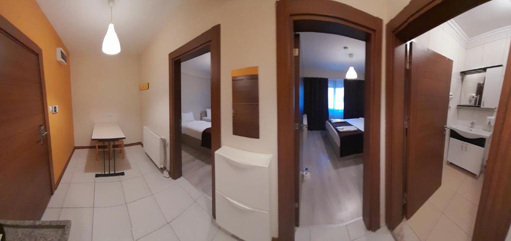 Postel nebo postele na pokoji v ubytování Moda Hotel