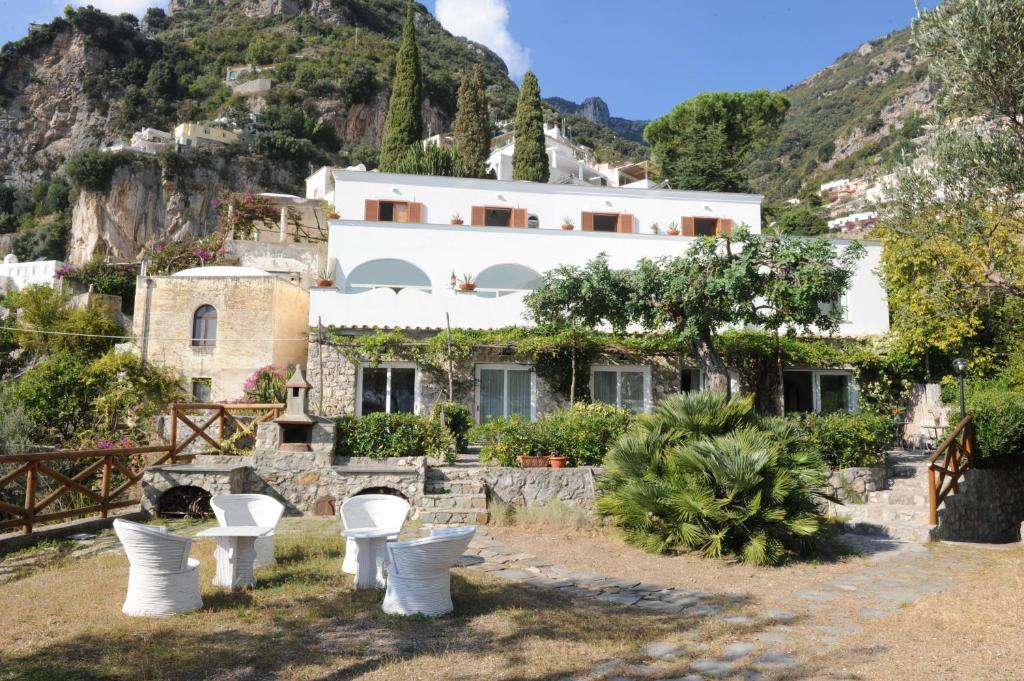 a house on a hill with toilets in front of it at Hotel Dimora Fornillo in Positano