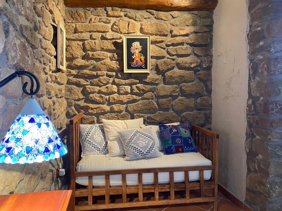 A bed or beds in a room at Casa rural CAL SERRA