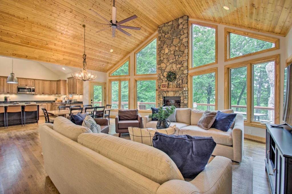 a large living room with couches and a kitchen at Luxe Wintergreen Resort Escape with Hot Tub! in Roseland