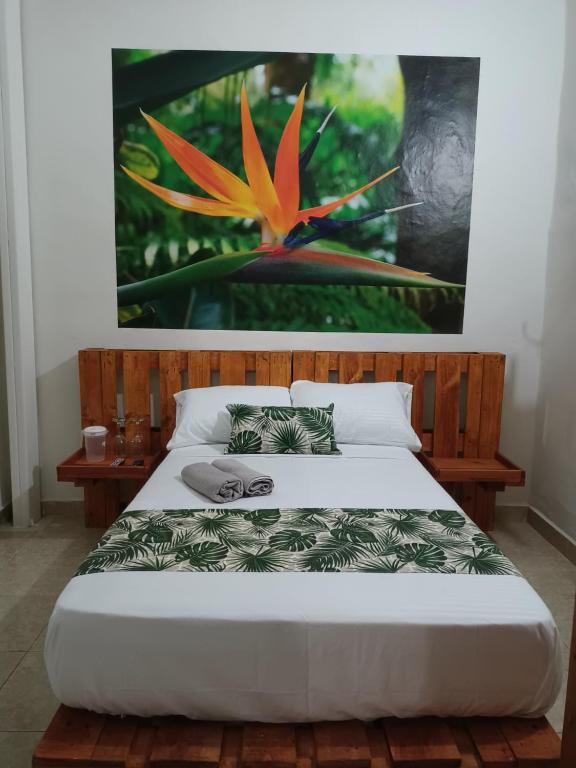 Кровать или кровати в номере Hospedajes El Jardin