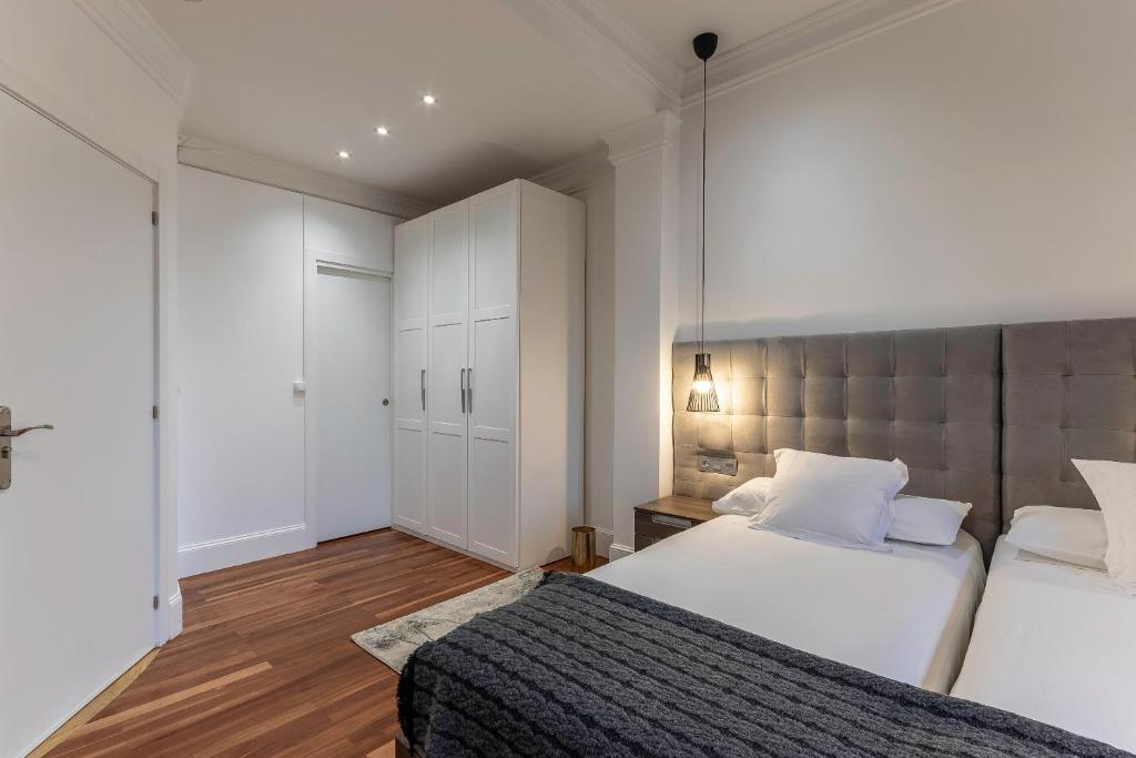 Кровать или кровати в номере Habitaciones Apartamento B&B Plaza Nueva 8