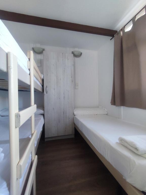 Cama o camas de una habitación en Camping Costa Blanca