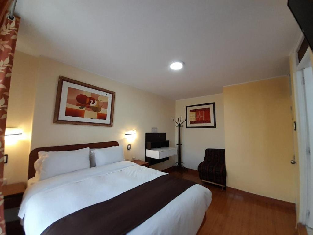 Cama o camas de una habitación en CasaHotel Centro - Huancayo