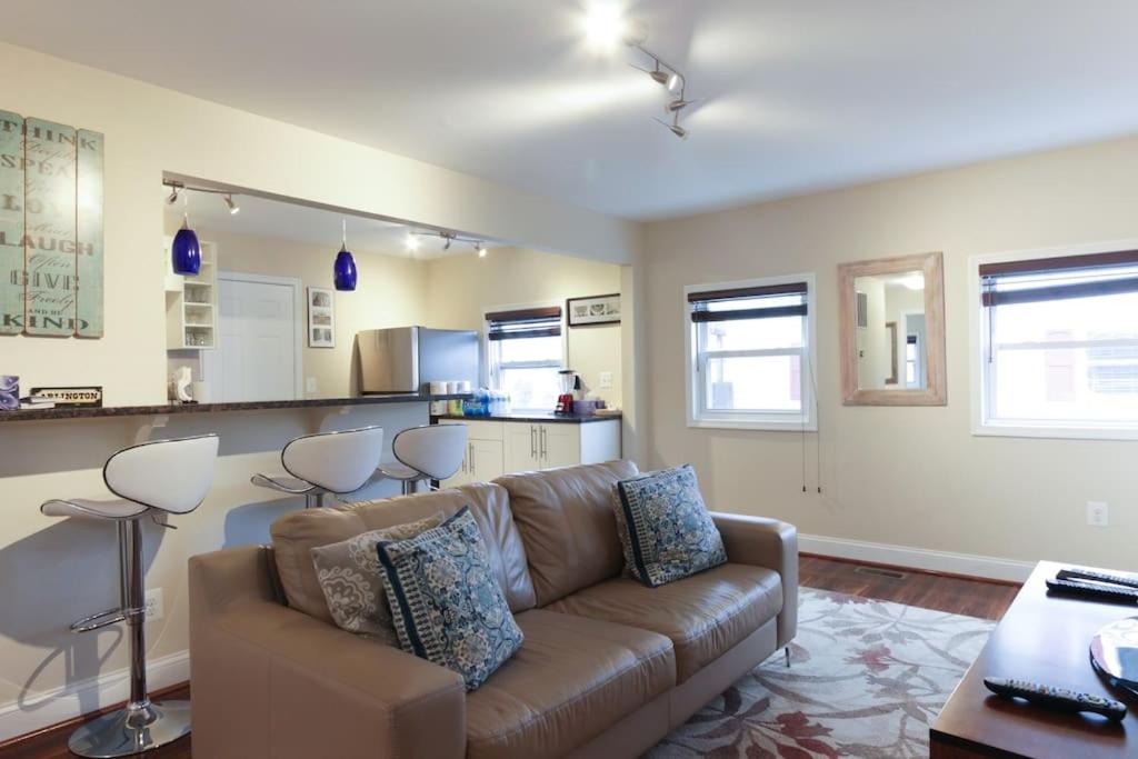 a living room with a couch and a kitchen at 2 bd 1 bth near DC! 7081 in Arlington
