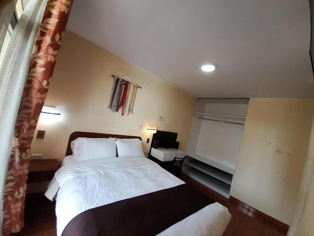 Cama o camas de una habitación en CasaHotel Centro - Huancayo