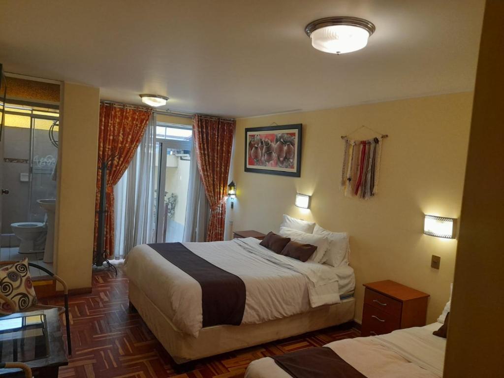 Cama o camas de una habitación en CasaHotel Centro - Huancayo