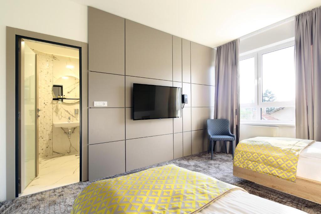 Postel nebo postele na pokoji v ubytování Hotel Koncept Residence