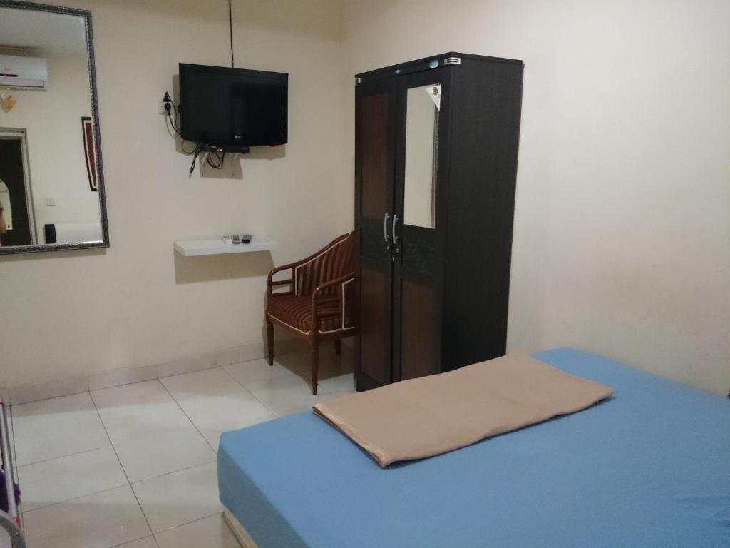 Postel nebo postele na pokoji v ubytování Pondok Seruni Kemanggisan Jakarta