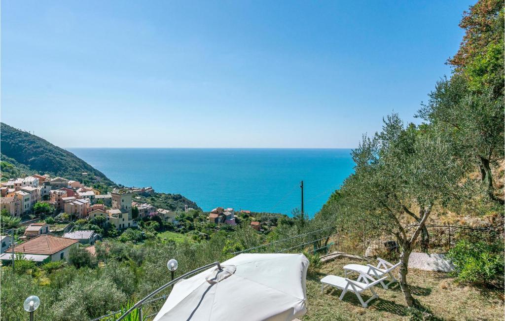 a tent on a hill with the ocean in the background at La Casa Gialla in Framura