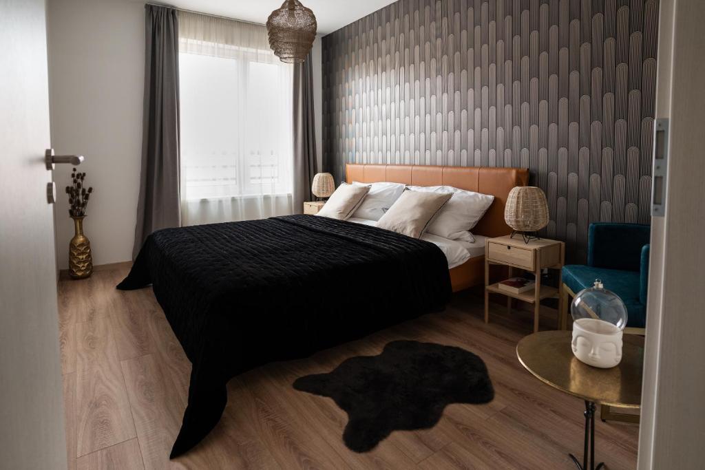 Postel nebo postele na pokoji v ubytování Cesar Apartman