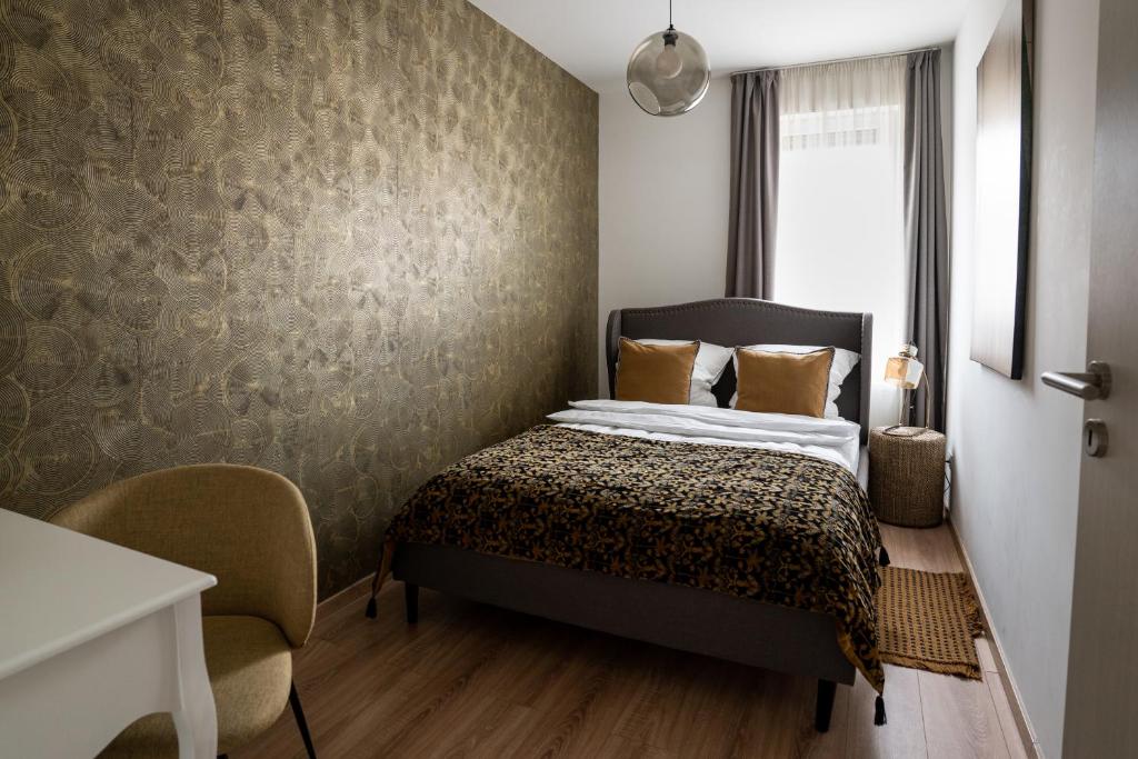 Postel nebo postele na pokoji v ubytování Cesar Apartman