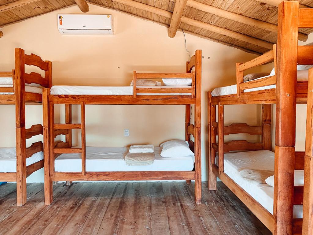 Postel nebo postele na pokoji v ubytování Caramuru Hostel Caraíva