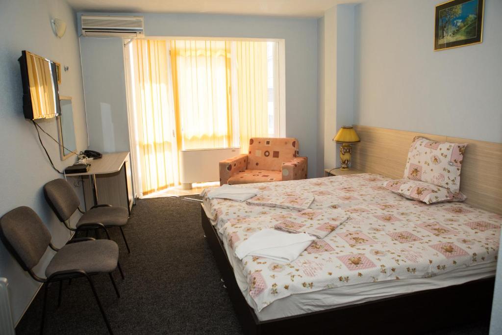Postel nebo postele na pokoji v ubytování Hotel Deva